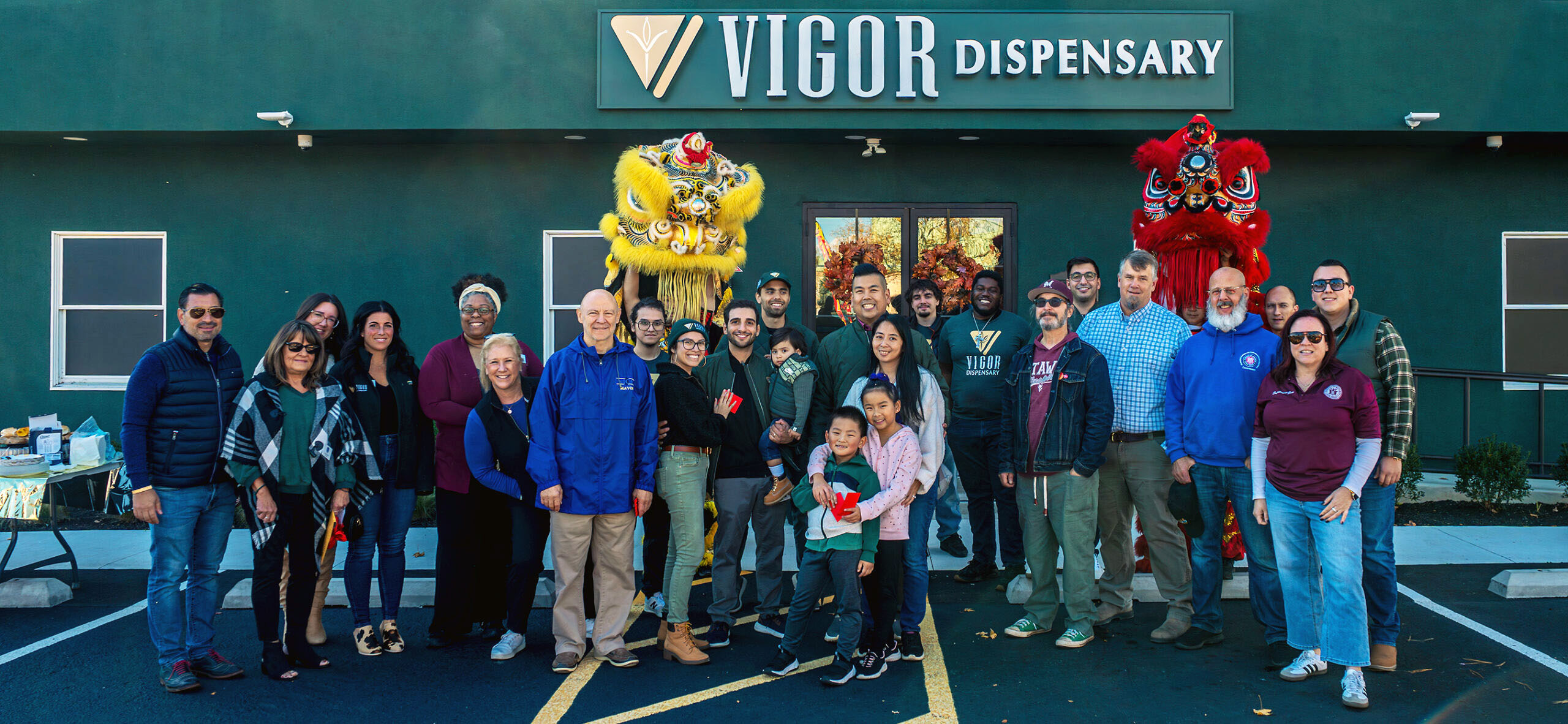 Vigor Dispensary in Matawan shot during opening day in front of the store with people gathered in front for a photo including lion dancers.